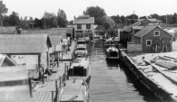 Fishtown facing east, showing the Leland Power House, ca. 1930s. Erhardt Peters Collection, LHS.