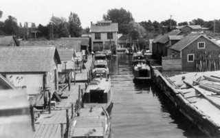 Fishtown facing east, showing the Leland Power House, ca. 1930s. Erhardt Peters Collection, LHS.