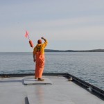 Returning the buoy to the water. All commercial fishing nets are marked.